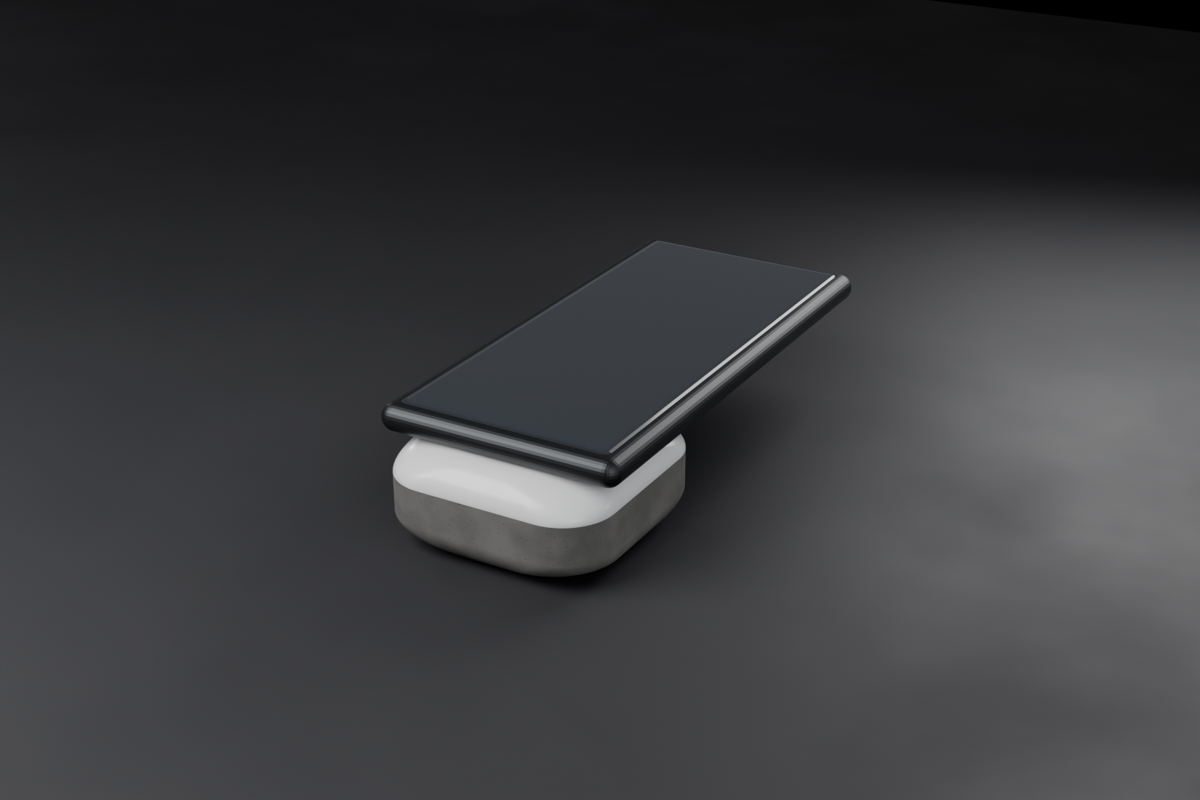 A phone resting against the stone — the stone is about half the phone's length.